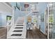 Stunning foyer with a grand staircase, soaring ceilings, and elegant decor providing a warm welcome at 4365 Wicklow Ct, Suwanee, GA 30024