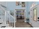 Elegant foyer with a staircase, stylish decor, and easy access to other rooms in the home's floorplan at 4365 Wicklow Ct, Suwanee, GA 30024