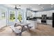 The bright kitchen features stainless steel appliances, white cabinets and plenty of counter space at 4365 Wicklow Ct, Suwanee, GA 30024