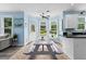 Eat-in kitchen offers backyard view, picnic table, and easy flow to living area with modern updates at 4365 Wicklow Ct, Suwanee, GA 30024