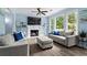 This bright living room is anchored by a fireplace and enjoys natural light and comfortable seating at 4365 Wicklow Ct, Suwanee, GA 30024