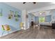 Spacious main bedroom with blue accent wall and tray ceiling at 4365 Wicklow Ct, Suwanee, GA 30024