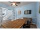 Well-lit office featuring wood-look floors and french doors leading to the stairway at 4365 Wicklow Ct, Suwanee, GA 30024