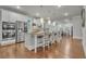 Spacious kitchen featuring a large island with seating, stainless steel appliances, and white cabinetry at 4511 Bridgeway Rd, Atlanta, GA 30331