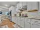 Well-lit kitchen with white cabinets, stainless steel appliances, and granite countertops at 4511 Bridgeway Rd, Atlanta, GA 30331
