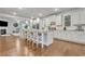 Large open kitchen with white cabinetry, granite counters, and a view into the living room at 4511 Bridgeway Rd, Atlanta, GA 30331