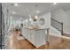 Kitchen island featuring pendant lighting, granite countertop, and stainless steel appliances at 4511 Bridgeway Rd, Atlanta, GA 30331