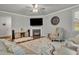 Cozy living room featuring a fireplace and hardwood floors at 4511 Bridgeway Rd, Atlanta, GA 30331