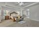 A generously sized main bedroom features tray ceiling, neutral decor, and a sitting area at 4511 Bridgeway Rd, Atlanta, GA 30331