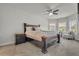 A stylish main bedroom provides a tranquil retreat with a seating area and lots of windows at 4511 Bridgeway Rd, Atlanta, GA 30331