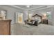Spacious main bedroom suite featuring a tray ceiling, decorative fan, and ensuite bathroom at 4511 Bridgeway Rd, Atlanta, GA 30331