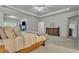 Spacious main bedroom featuring a tray ceiling, mirror, and carpet floors at 4511 Bridgeway Rd, Atlanta, GA 30331