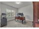 Functional office space featuring neutral walls, carpet floors, and a large window at 4511 Bridgeway Rd, Atlanta, GA 30331