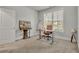 Home office featuring a large window, carpet floors, and natural lighting at 4511 Bridgeway Rd, Atlanta, GA 30331