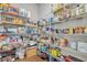 Pantry with shelves stocked with a variety of food and household items at 4511 Bridgeway Rd, Atlanta, GA 30331