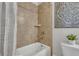 A shower and tub combination features tiled walls and a shower curtain at 4511 Bridgeway Rd, Atlanta, GA 30331