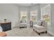 Bright sitting area features two chairs and a small table at 4511 Bridgeway Rd, Atlanta, GA 30331