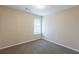 Cozy bedroom with natural light showcasing neutral walls and carpet at 6590 Smoke Ridge Dr, Atlanta, GA 30349