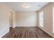 Spacious living room with hardwood floors and bright light at 6590 Smoke Ridge Dr, Atlanta, GA 30349