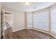 Inviting living room with hardwood floors and bright bay windows at 6590 Smoke Ridge Dr, Atlanta, GA 30349