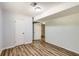 Bedroom features wood-look flooring, neutral walls, closet, and easy access to another room at 3551 Cindy Way, Rex, GA 30273