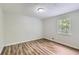 Bedroom with modern flooring, a window, and light paint at 3551 Cindy Way, Rex, GA 30273
