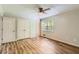 Bright bedroom boasting wood-look floors, a window, and a double-door closet at 3551 Cindy Way, Rex, GA 30273