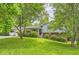 Lovely home with blue siding, lush green lawn, mature trees, and inviting front entrance at 3551 Cindy Way, Rex, GA 30273