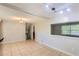 Spacious kitchen features tile flooring, neutral walls, a view to stairs, and modern lighting at 3551 Cindy Way, Rex, GA 30273