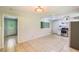 Large kitchen features white cabinets, stainless steel appliances, tile floors, and lots of room at 3551 Cindy Way, Rex, GA 30273