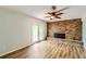 Cozy living room with fireplace, double doors to the exterior, and hard surface floors at 3551 Cindy Way, Rex, GA 30273
