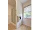 Bathroom featuring a standing shower and window at 6191 Cumming Hwy, Canton, GA 30115