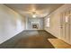 Spacious living room featuring a brick fireplace, ceiling fan and neutral walls at 6191 Cumming Hwy, Canton, GA 30115