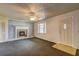 The living room features a painted brick fireplace and neutral walls and carpet at 6191 Cumming Hwy, Canton, GA 30115