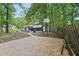 Spacious backyard featuring a basketball court and view of the back of the house at 6700 Knollwood Cir, Douglasville, GA 30135
