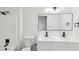 Modern bathroom featuring a double vanity with sleek fixtures and contemporary lighting at 6700 Knollwood Cir, Douglasville, GA 30135