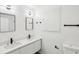 Modern bathroom with sleek double vanity, contemporary fixtures, and stylish lighting at 6700 Knollwood Cir, Douglasville, GA 30135