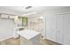 Kitchen featuring an island, white cabinets, modern countertops, and stainless-steel sink at 6700 Knollwood Cir, Douglasville, GA 30135