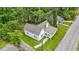 Eye-level view showcasing the home's clean design, nice yard, and access to a nearby street at 6802 Ida St, Lithonia, GA 30058