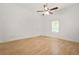 Simple bedroom featuring hardwood floors and a ceiling fan at 6802 Ida St, Lithonia, GA 30058