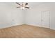 Minimalist bedroom design featuring hardwood floors and neutral colors at 6802 Ida St, Lithonia, GA 30058