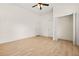 A bright bedroom with hardwood flooring, closet, and entry to other room at 6802 Ida St, Lithonia, GA 30058