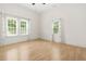 Bright, spacious bedroom with hardwood flooring and natural light at 6802 Ida St, Lithonia, GA 30058