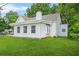 Attractive home featuring neat white siding and a lush green lawn at 6802 Ida St, Lithonia, GA 30058