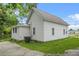Charming home with vinyl siding and a well-maintained lawn and side parking area at 6802 Ida St, Lithonia, GA 30058