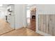 Inviting living room with a cozy fireplace and view into updated kitchen with stainless steel appliances at 6802 Ida St, Lithonia, GA 30058