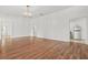 Bright living room featuring hardwood floors and a charming chandelier at 6802 Ida St, Lithonia, GA 30058