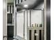 Elegant bathroom featuring a glass-enclosed shower with a tiled base and convenient storage at 800 Peachtree Ne St # 1014, Atlanta, GA 30308