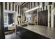 Stylish black and white bathroom featuring a long vanity with dual sinks, mirrors, and modern fixtures at 800 Peachtree Ne St # 1014, Atlanta, GA 30308