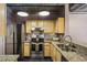 Well-equipped kitchen featuring stainless steel appliances and granite countertops at 800 Peachtree Ne St # 1014, Atlanta, GA 30308